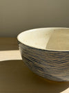 Deep Blue bowl – close-up of the speckled cream interior and blue lines