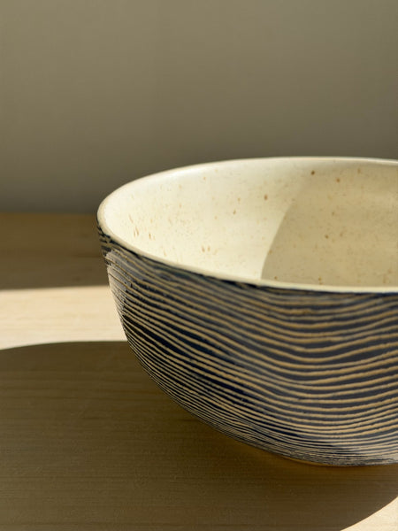 Deep Blue bowl – close-up of the speckled cream interior and blue lines