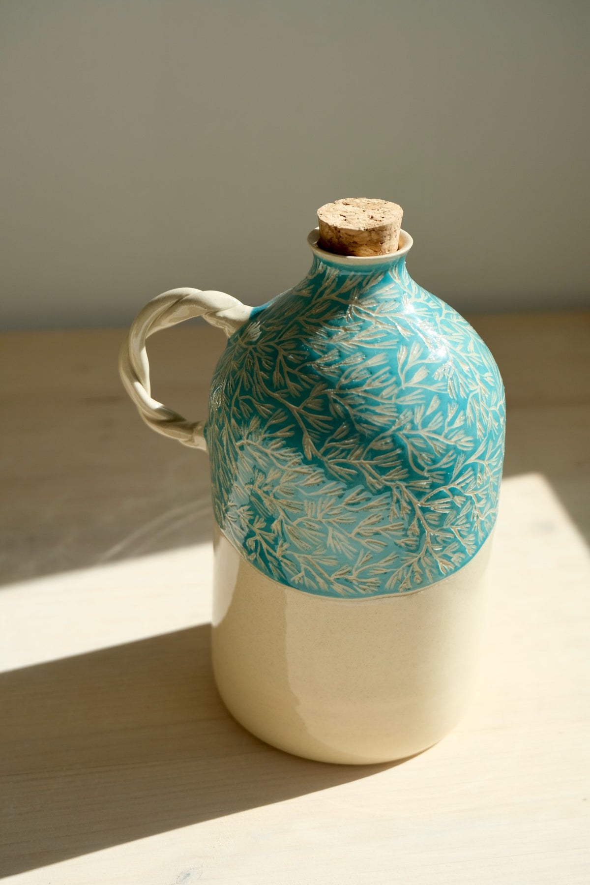 Green Pine olive oil bottle – handmade ceramic olive oil bottle with densely carved pine pattern, cork and twisted handle