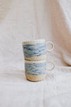 Latte Waves cups – handmade stoneware mugs with blue wave lines, stacked