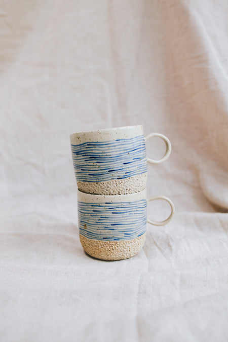 Latte Waves cups – handmade stoneware mugs with blue wave lines, stacked