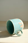 Taza Latte Coral tumbada de lado