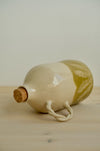 Rosemary Olivenölflasche auf der Seite liegend