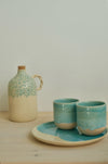 Pine olive oil bottle with Beach espresso cups on a Sea plate