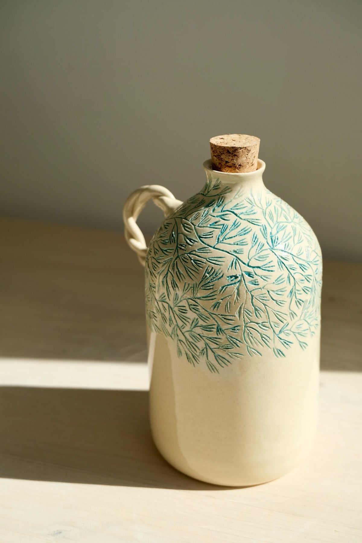 Pine olive oil bottle – handmade ceramic olive oil bottle with carved turquoise pine pattern, cork and twisted handle